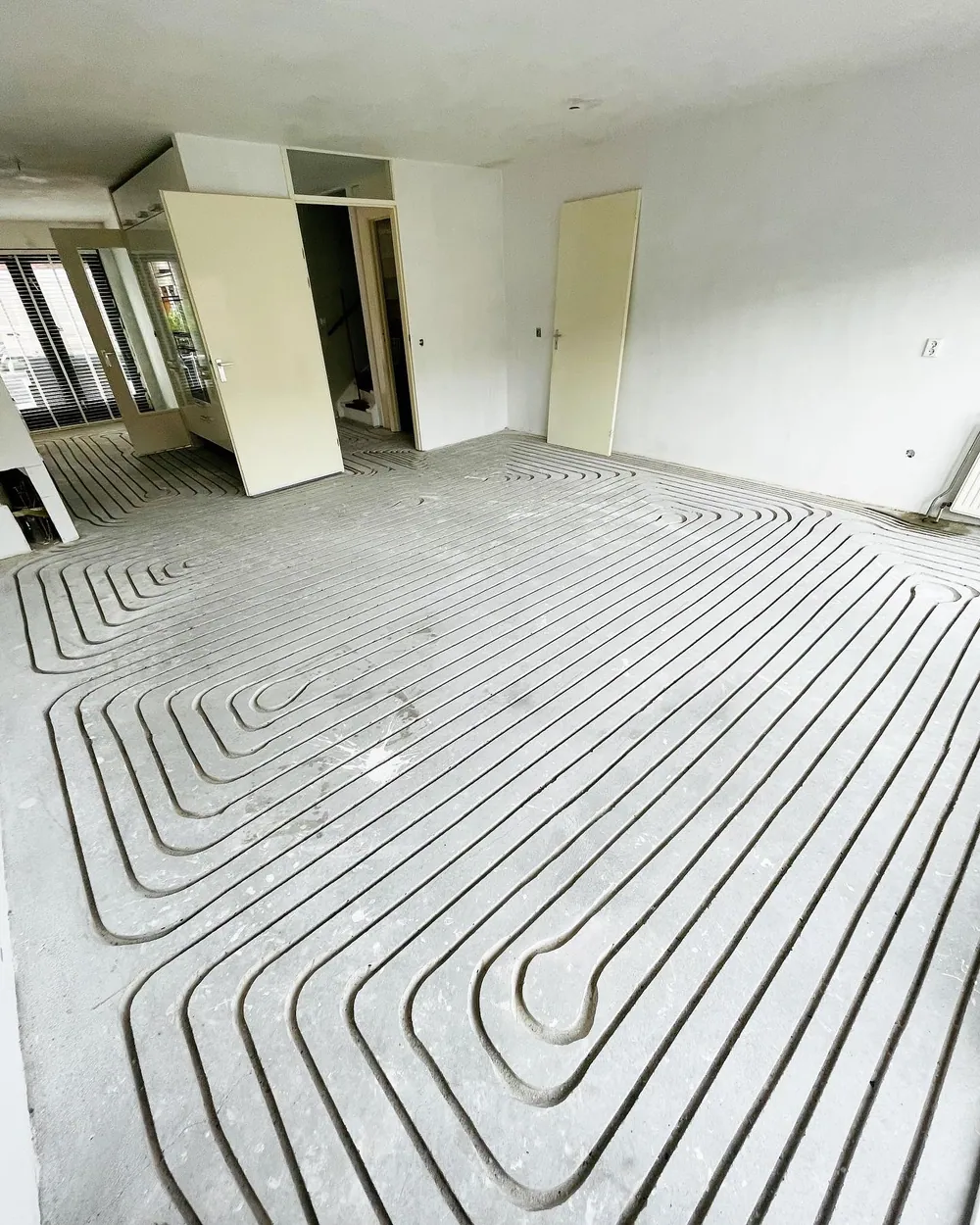 Afgewerkte vloerverwarming installatie op zolderverdieping